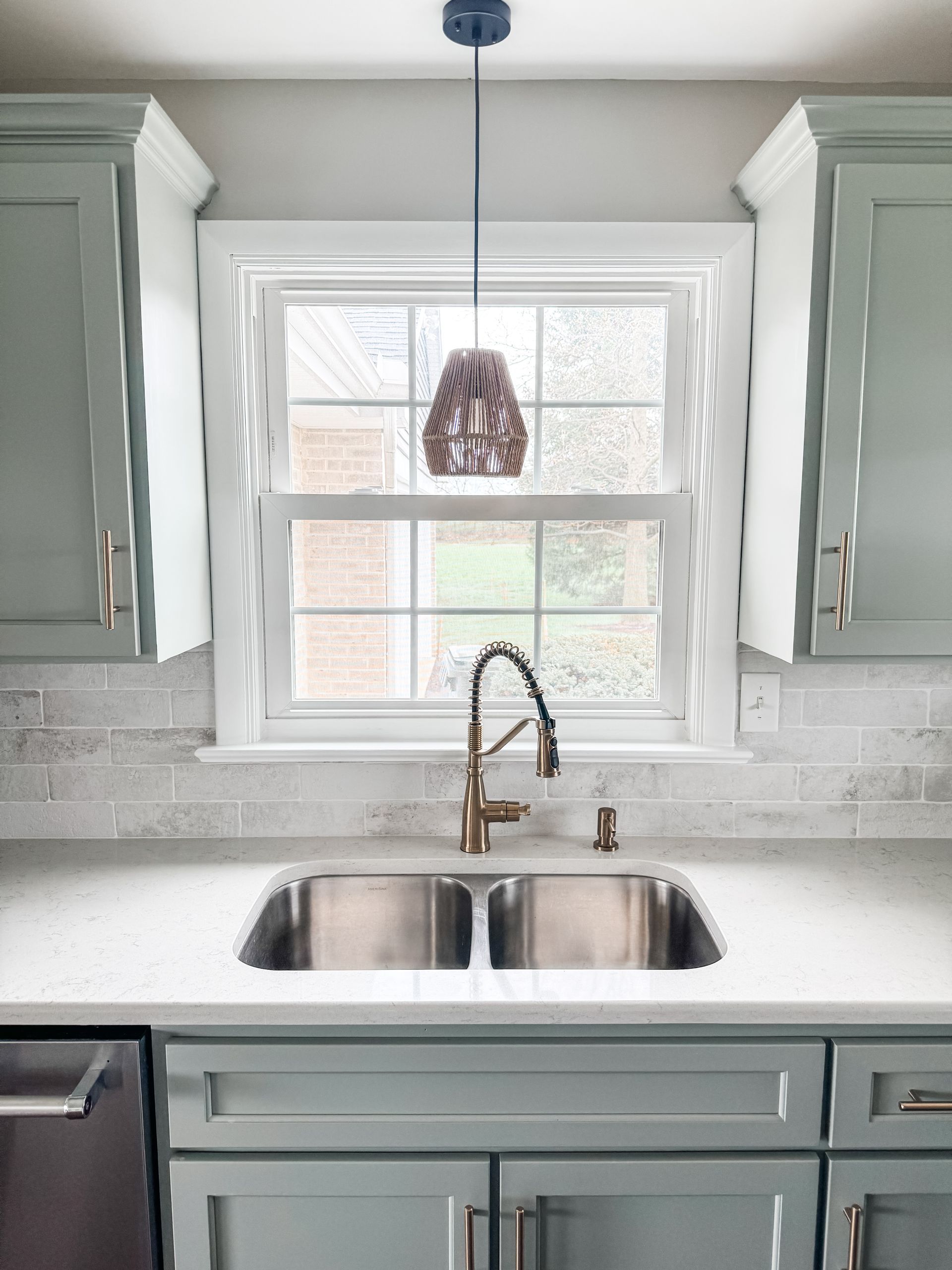 Beautiful kitchen sink and backsplash by Lapp Cabinet Coatings