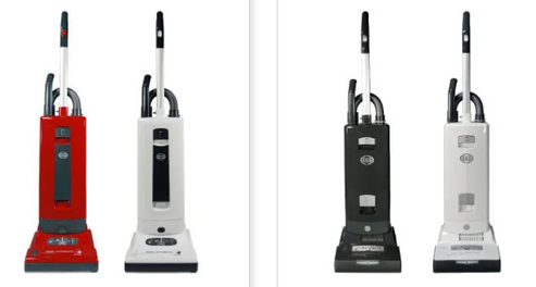 Four upright vacuum cleaners in a row, displayed in red, off-white, black, and white colors against a white background.
