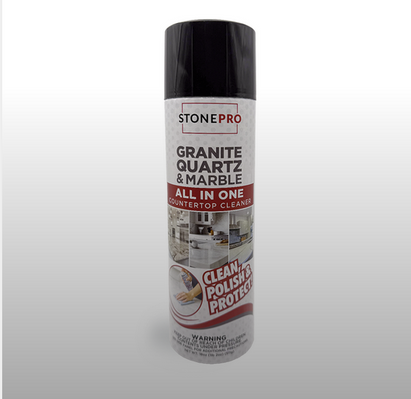 A canister of StonePro Granite, Quartz & Marble All In One cleaner with black cap and white label on a grey background.