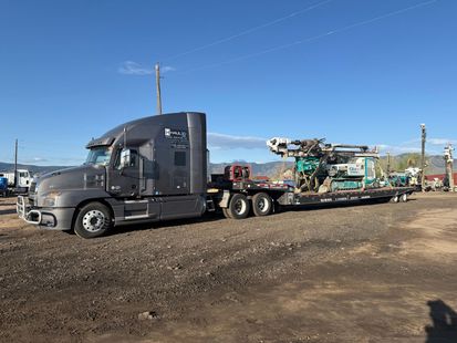 Gooseneck trailer hauling classic cars