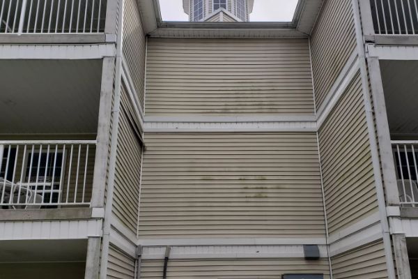 A building with stairs leading up to the top of it
