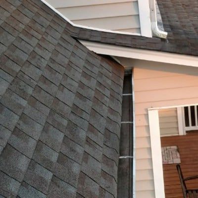 A house with a roof that has shingles on it