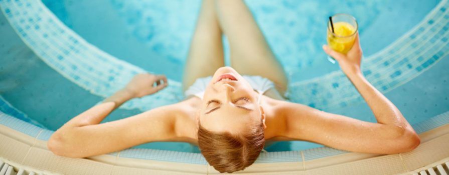 Woman Relaxing in Hot Tub