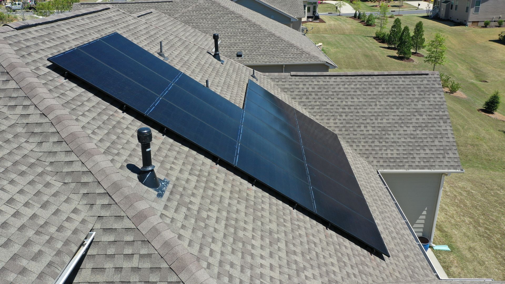 A roof with a lot of solar panels on it