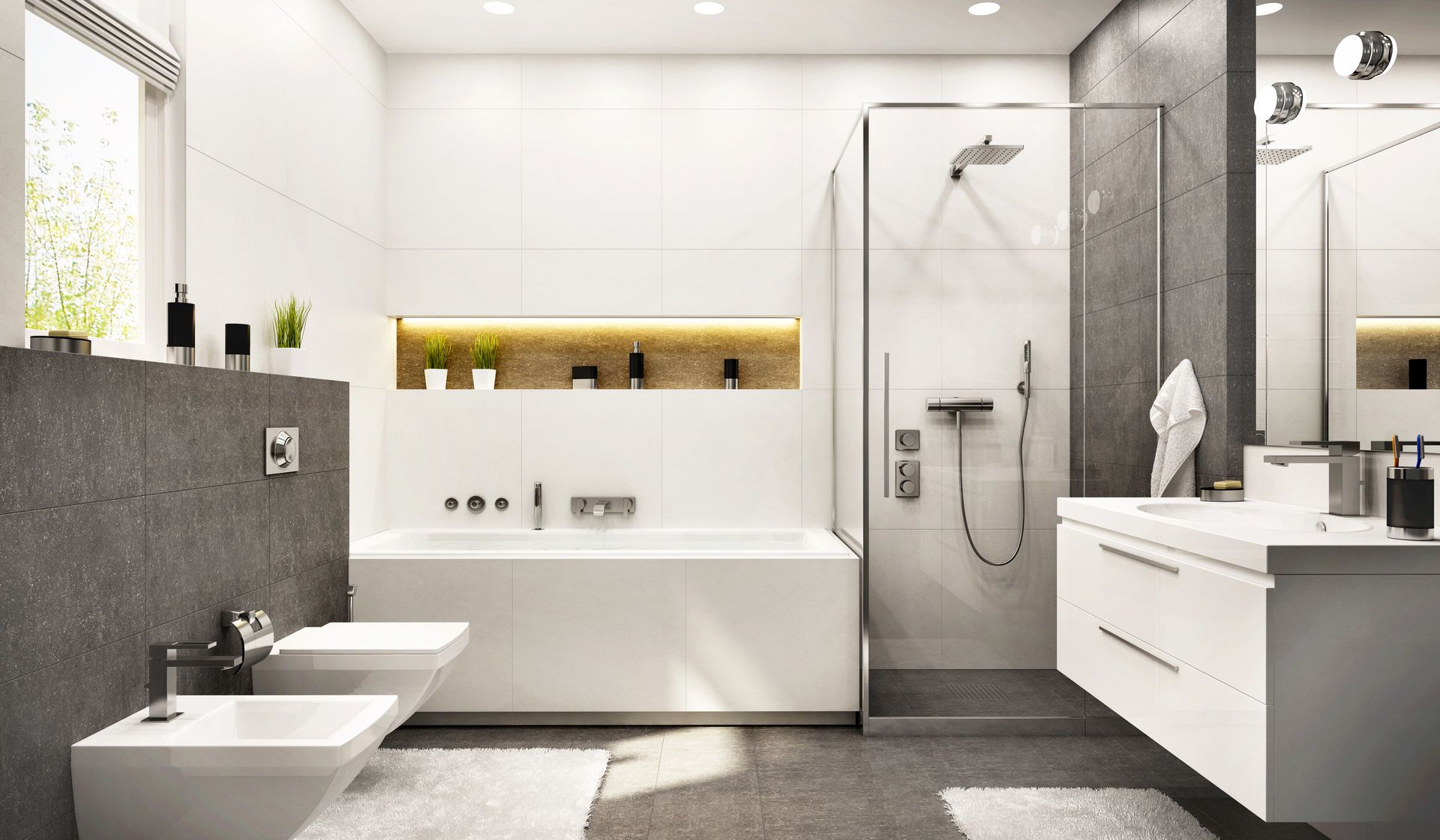 Modern white and gray bathroom with bathtub, shower, toilet, sink, and wall shelf with lit niche