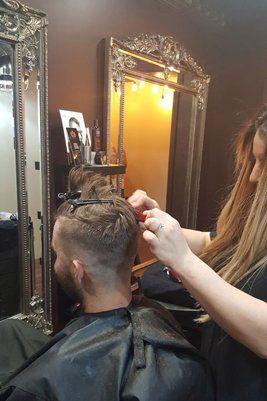 man getting hair styled