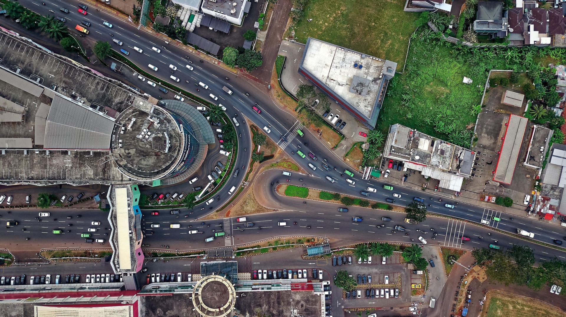 An aerial view of a busy intersection with a lot of traffic.