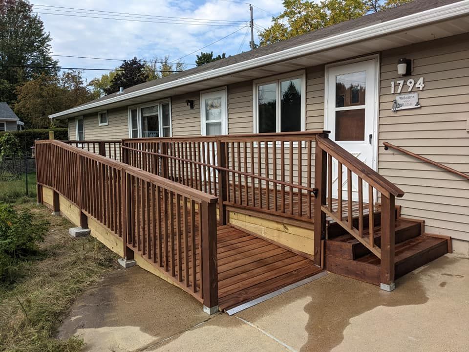 A house with a ramp and stairs in front of it