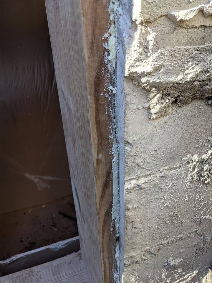 A close up of a brick wall with a hole in it.