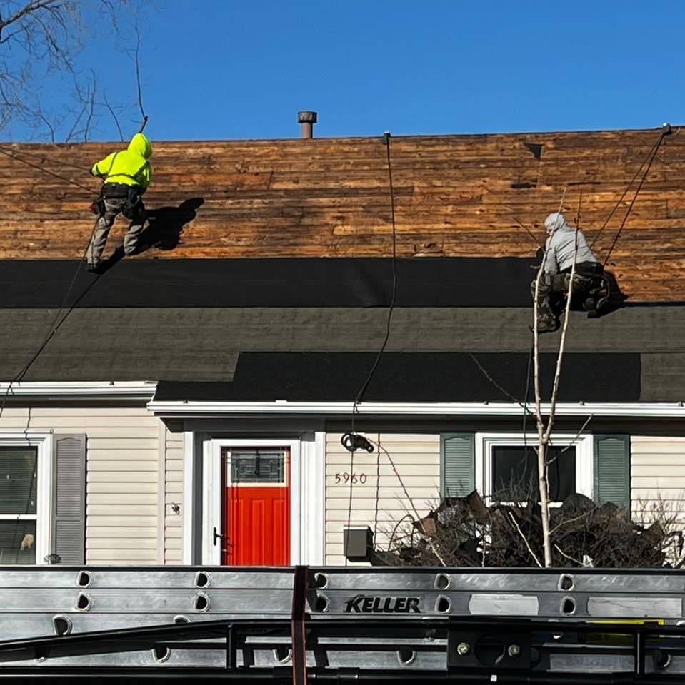 A keller ladder is sitting in front of a house