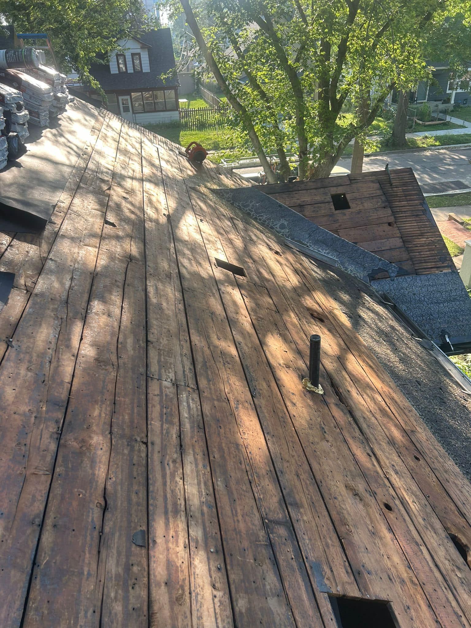 A wooden deck is sitting on top of a roof.