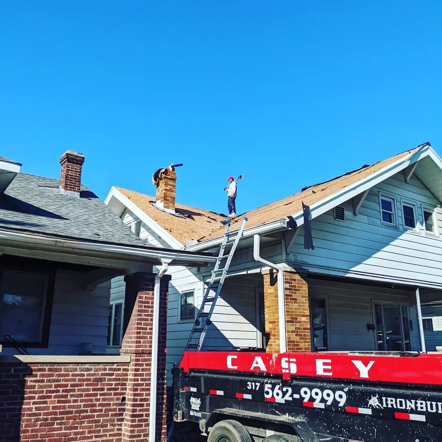 A casey truck is parked in front of a house