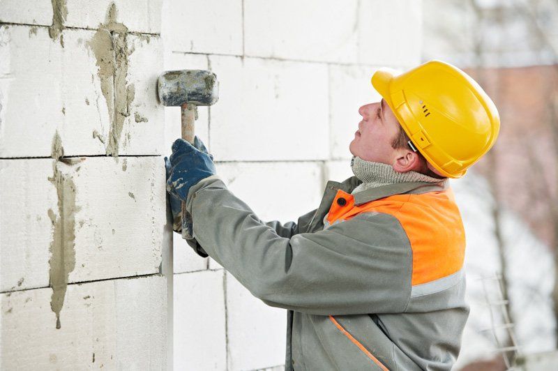 Contractor renovating a wall