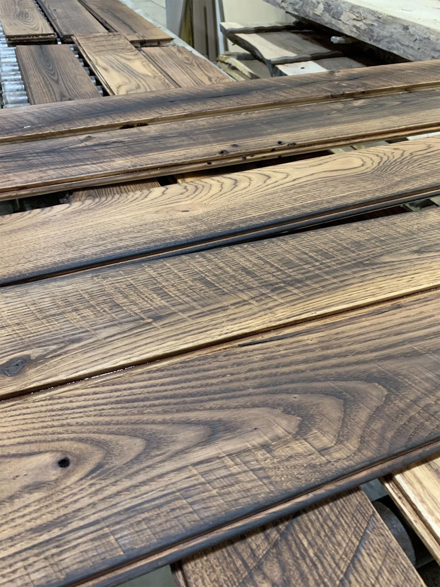 Weathered wooden deck boards with visible grain and gaps between planks