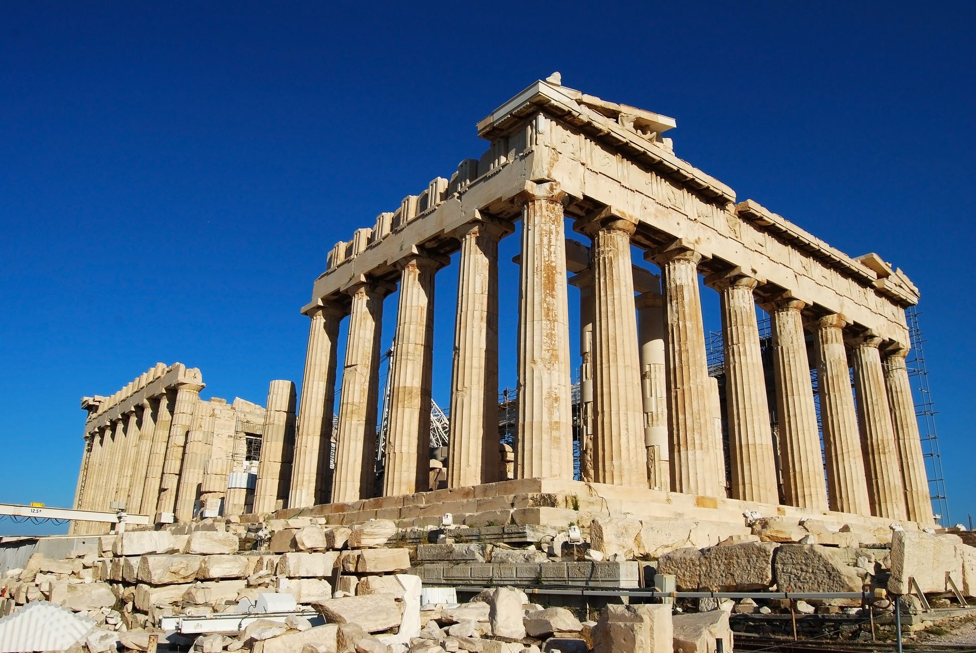 Parthenon ruins against a clear blue sky in Athens, Greece.