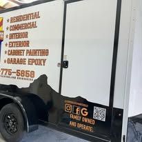 White trailer with black fenders; text says 