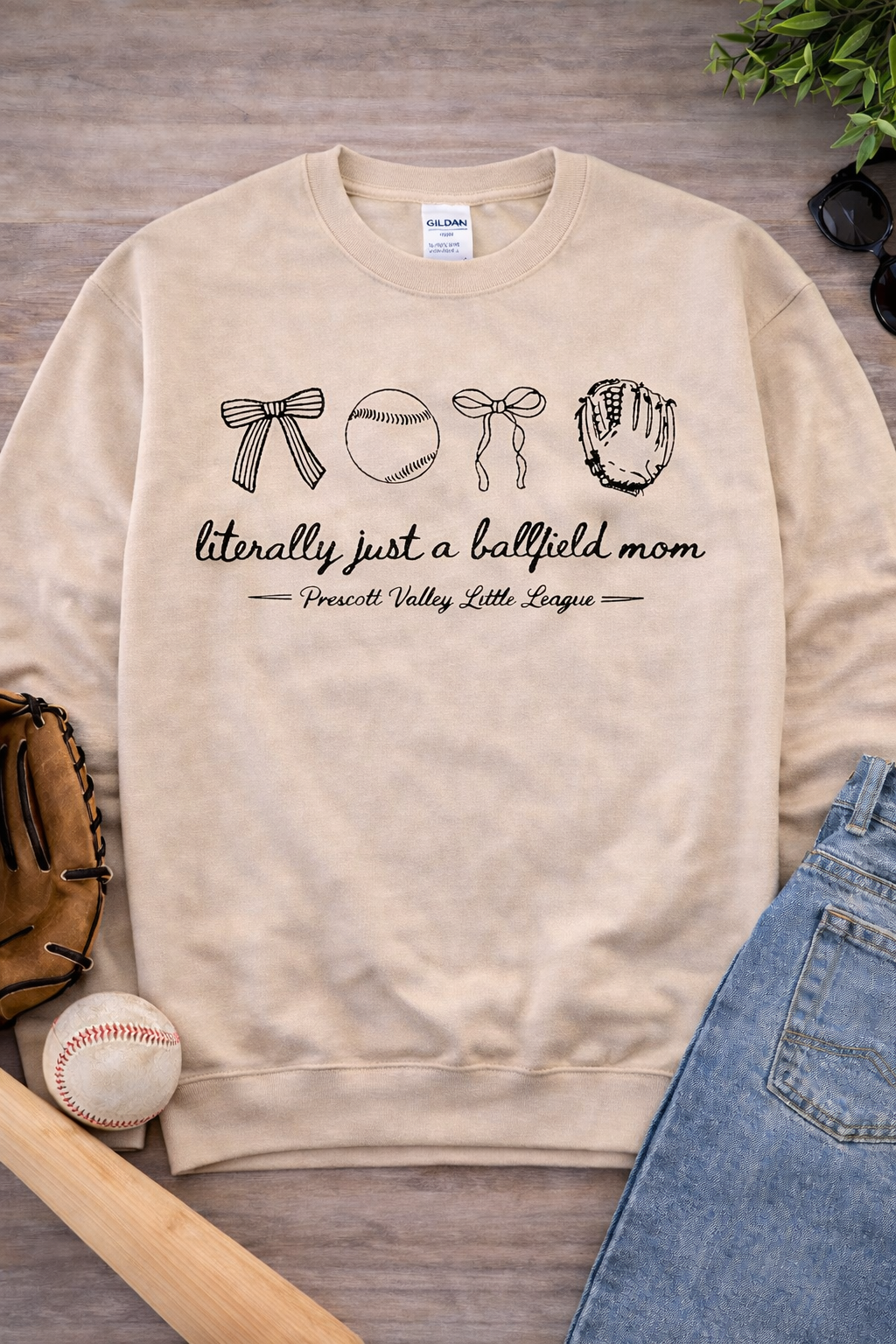 Beige sweatshirt with baseball-themed graphic and text: 