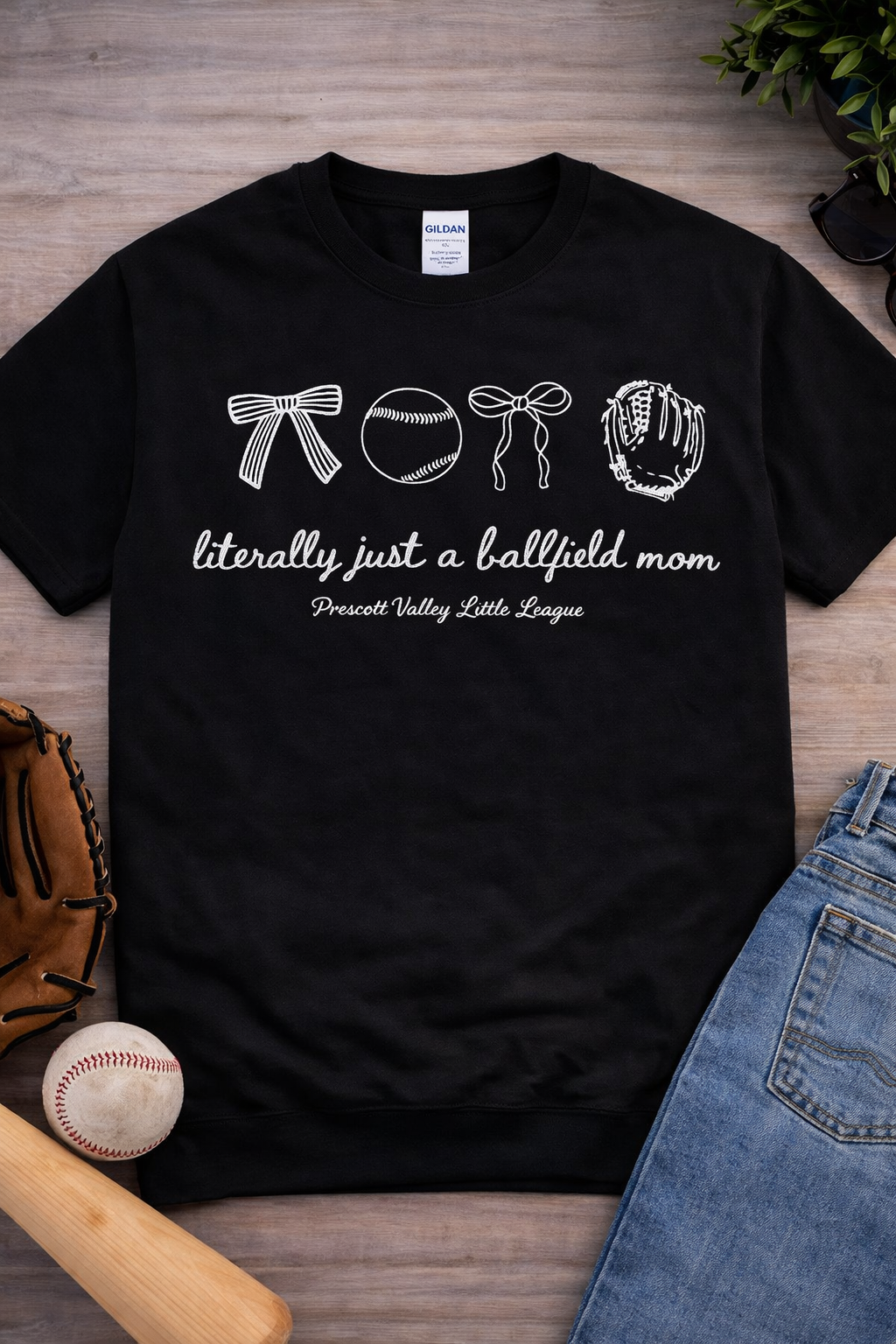 Black t-shirt with baseball-themed graphic and text: 
