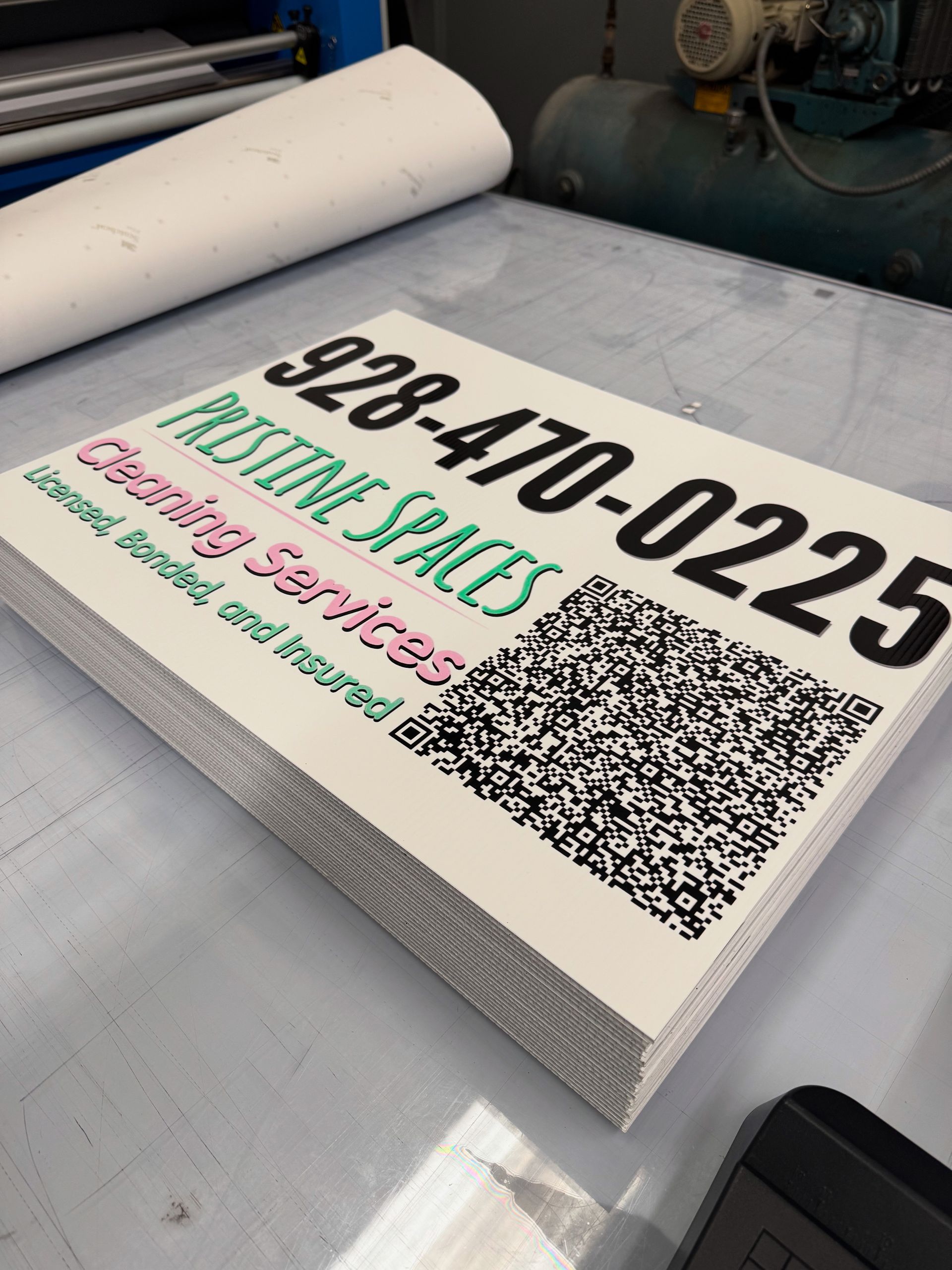 Stack of printed business signs for