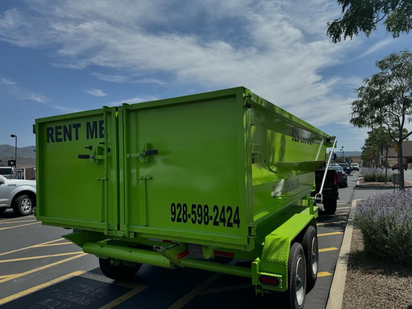 Bright green dumpster trailer with 