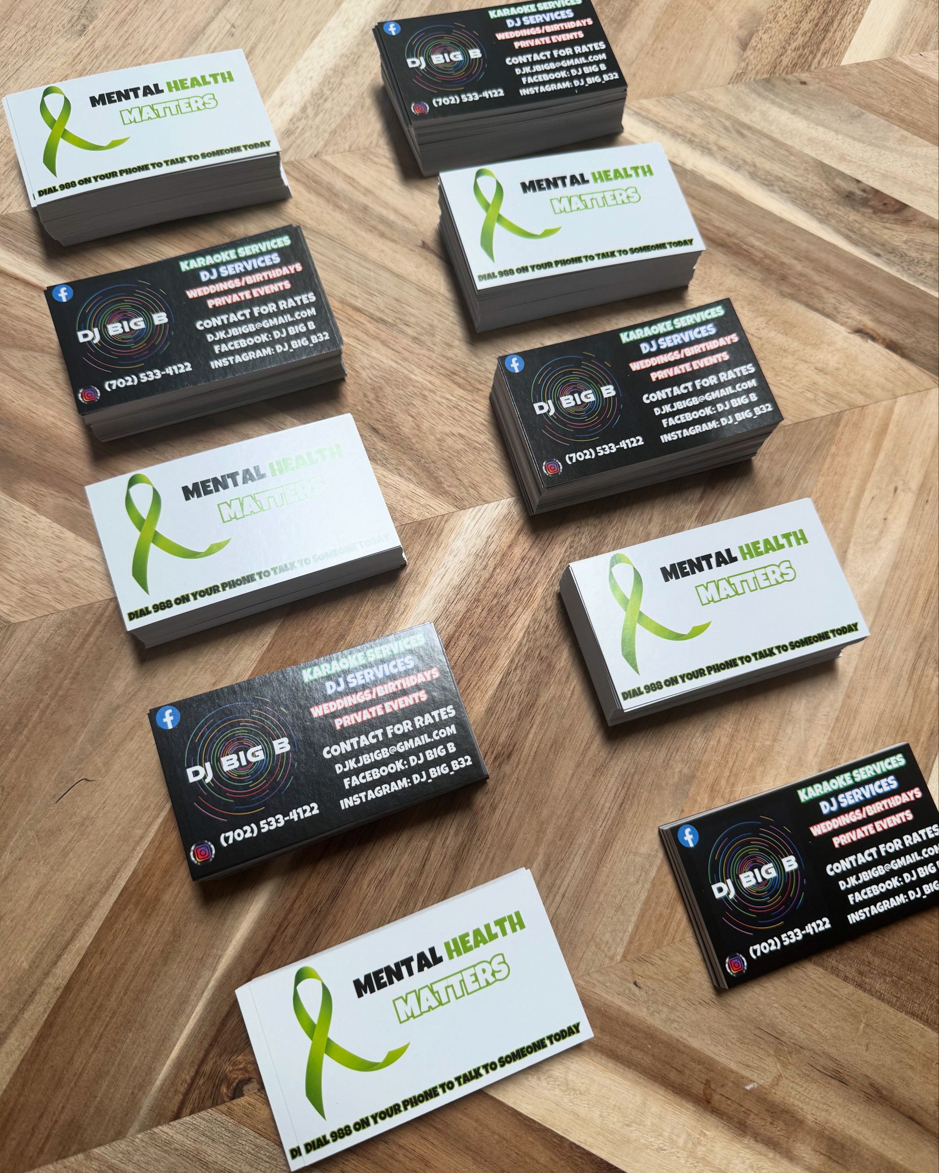 Business cards with a green ribbon and