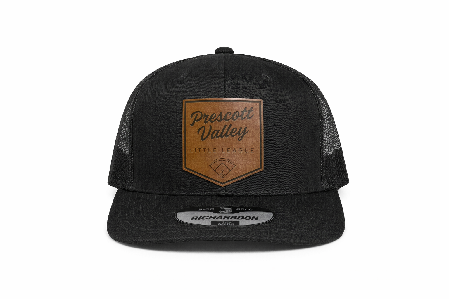Black trucker hat with a brown leather patch that reads 