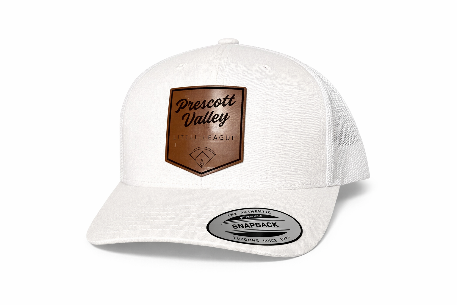 White trucker hat with a brown leather patch that reads 