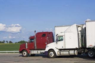 a red and white logistic truck