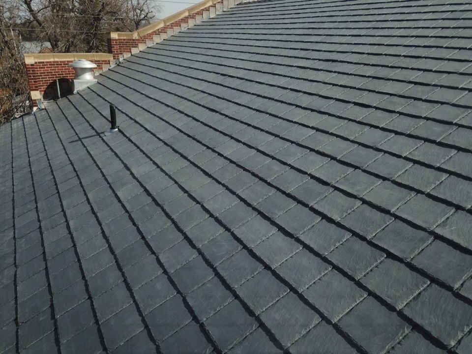 Dark gray tile roof with rectangular tiles.