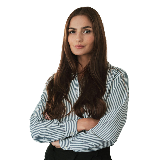 A woman in a striped shirt with her arms crossed