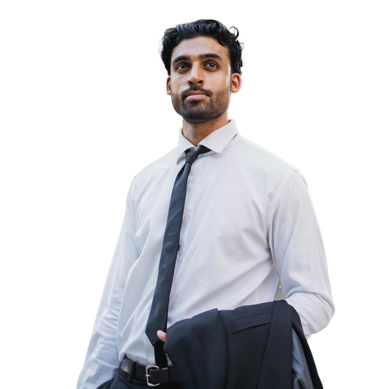 A man in a white shirt and black tie is holding a jacket over his shoulder.