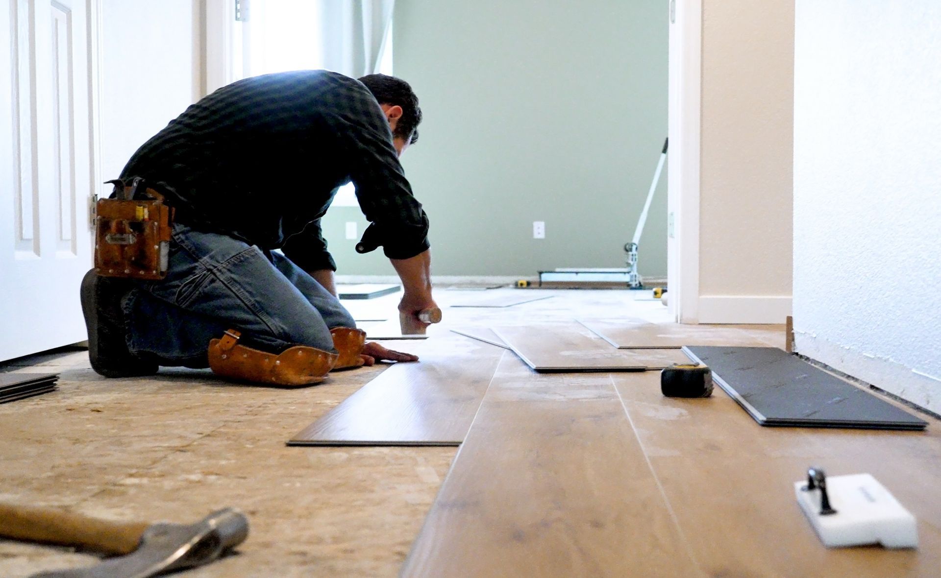 A Man Installing A Floor | Fort Myers, FL | Emerald Green