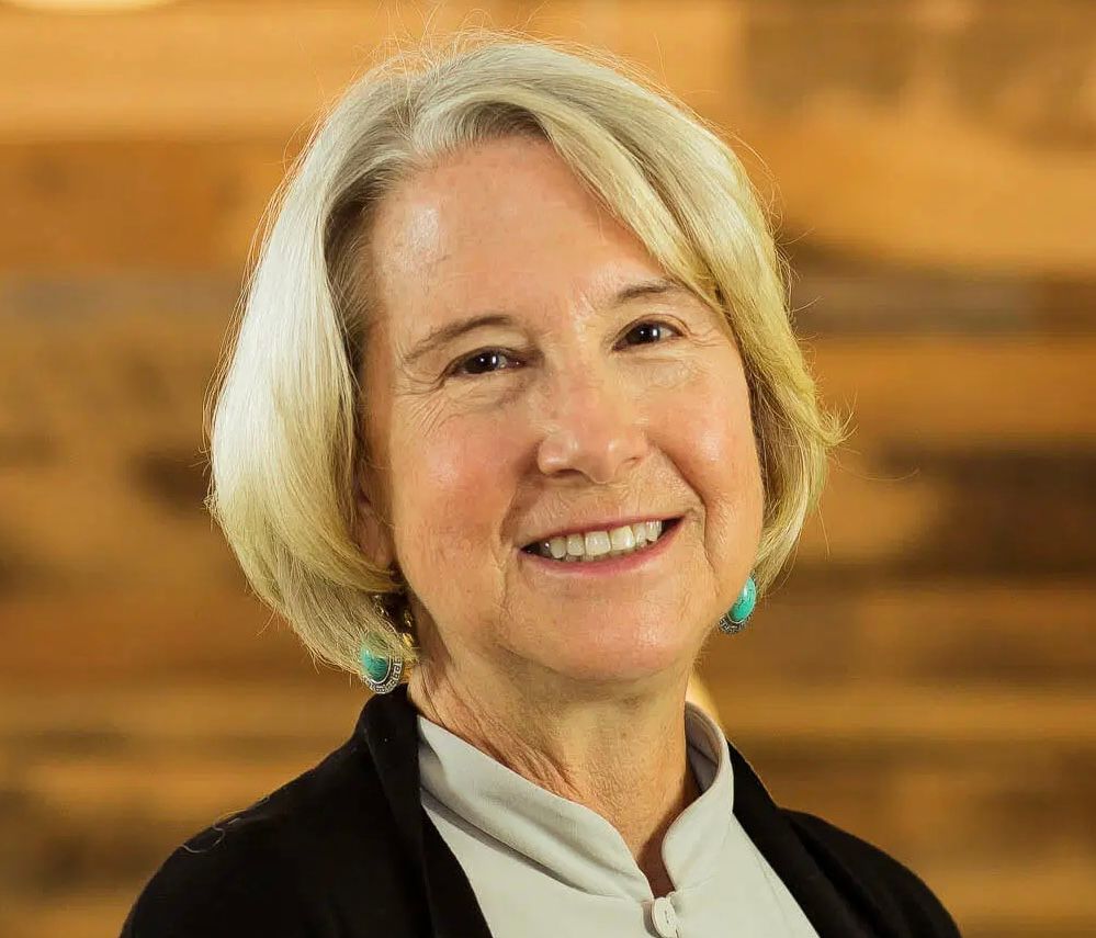 A headshot image of Carrie Hessler-Radelet