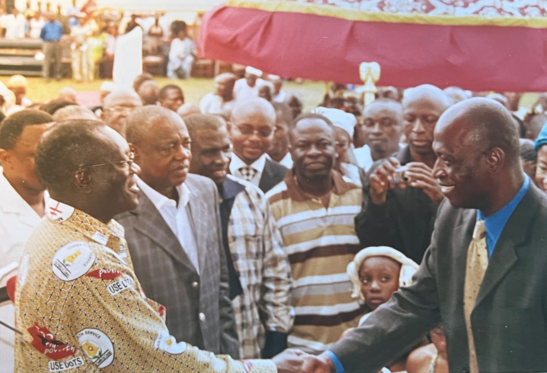 An image of Matt Essieh with local leaders in his hometown of Sampa, Ghana