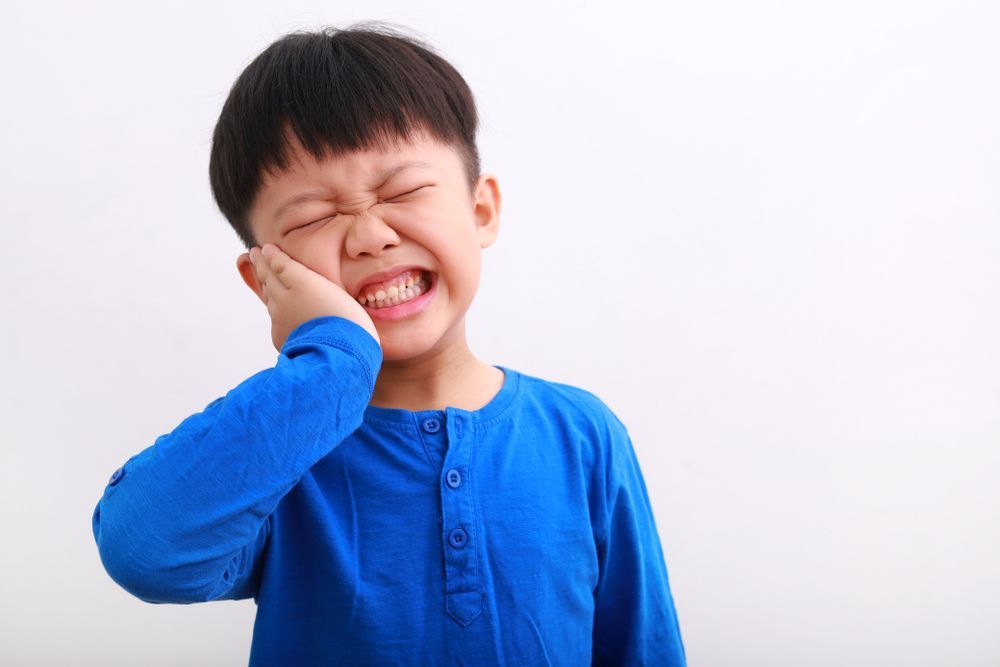 little boy with toothache