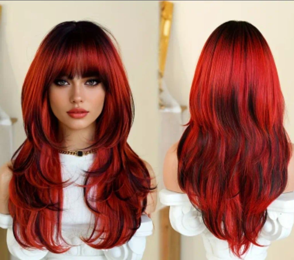 Woman wearing a layered red and black wig with bangs, facing forward and from the back, indoors.