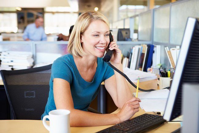 Modern Office with Woman on Phone and Computer — Eatontown, NJ — Executive Suites at 12 Christopher Way