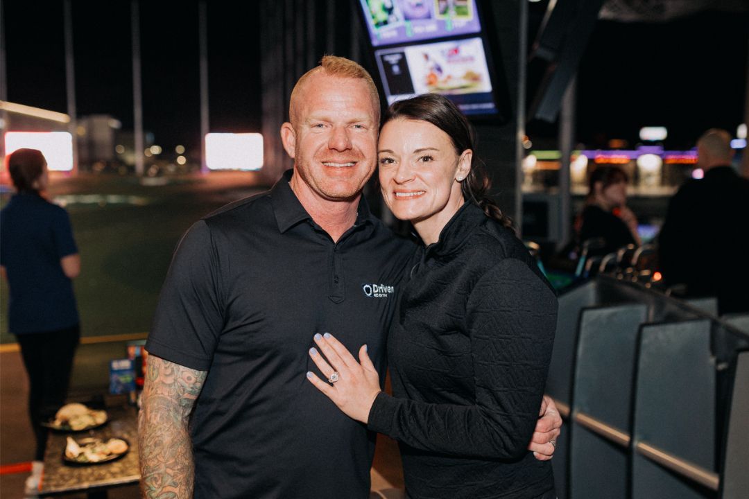 A man and a woman are posing for a picture together.