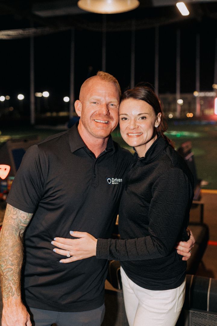 A man and a woman are posing for a picture together.