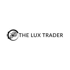 A black and white logo for the lux trader with a chameleon in a circle.