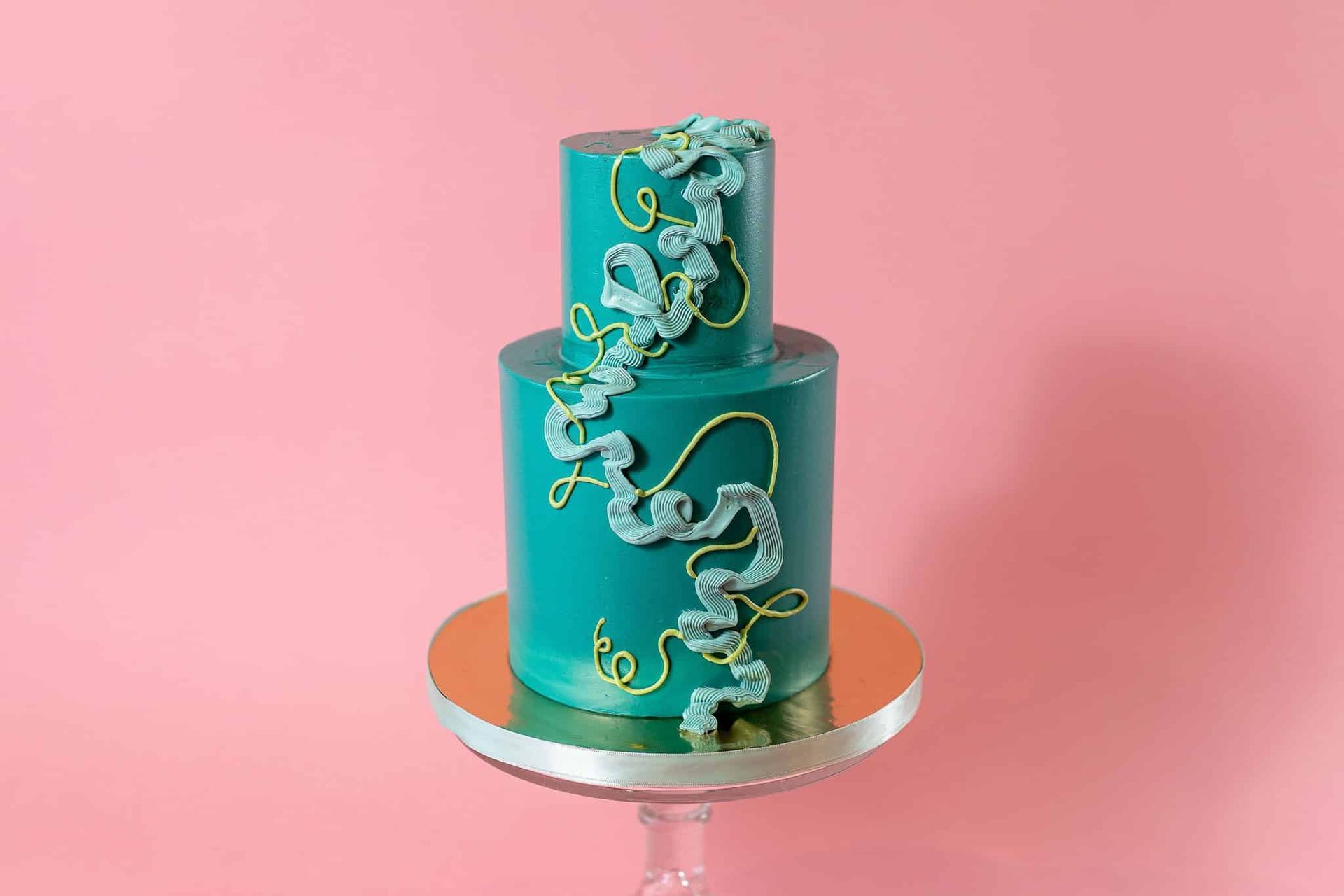 The bride is holding a bouquet of flowers in front of a mirror.