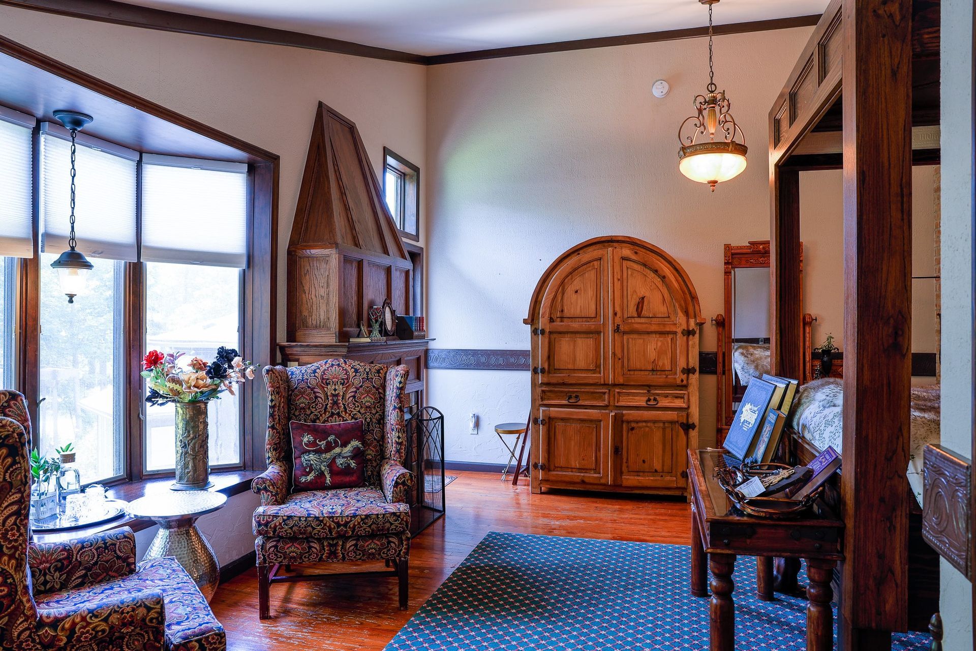 A living room with a lot of furniture and a large window