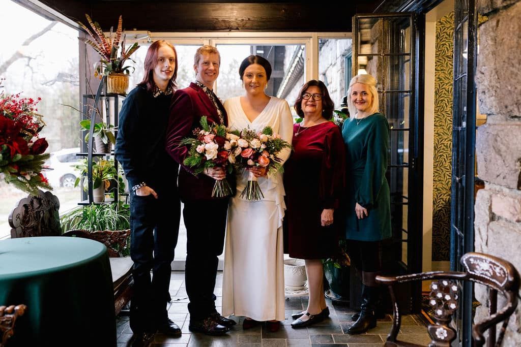 A group of people standing next to each other in a room.