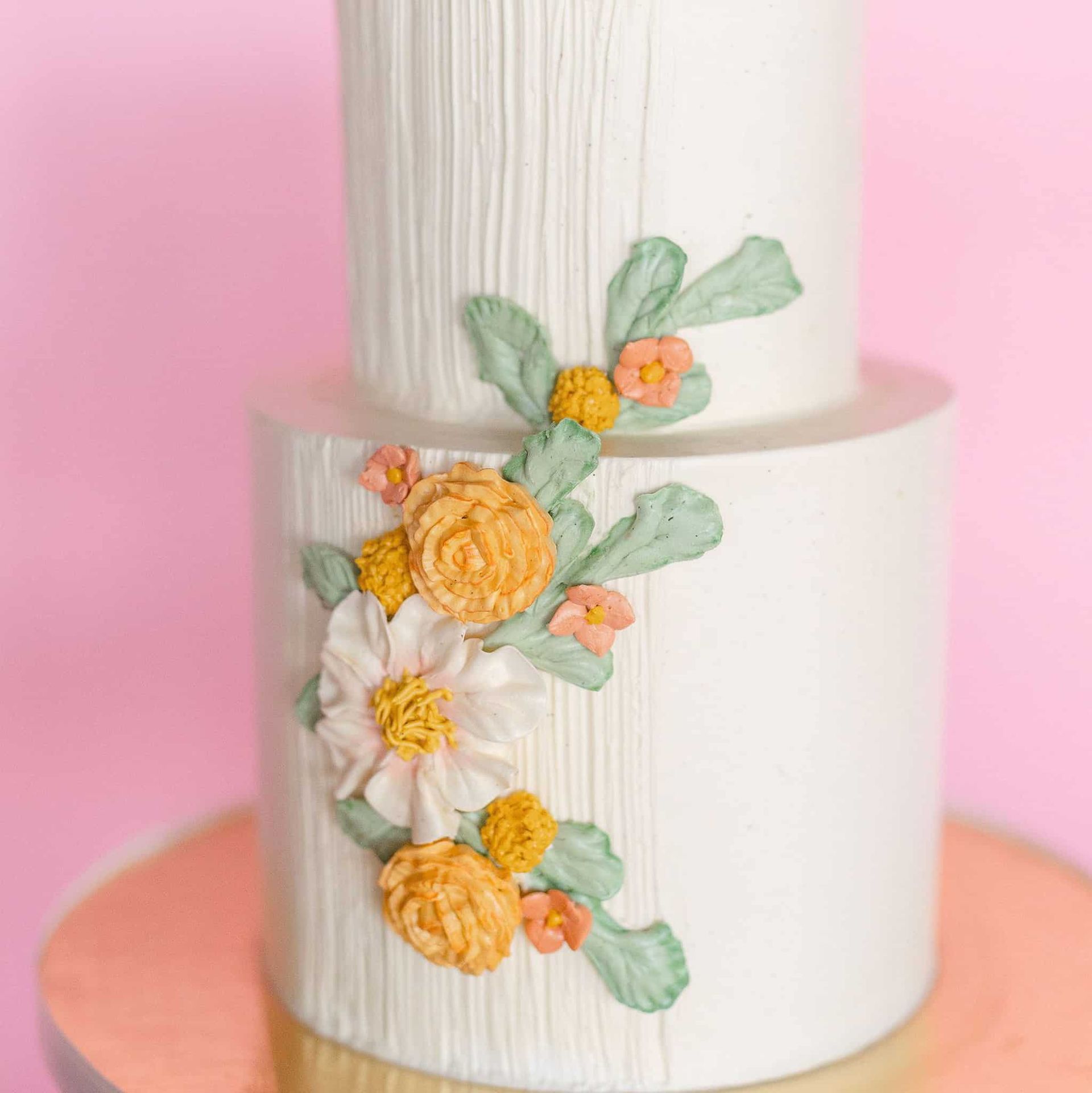 A woman in a black dress is holding a bouquet of flowers