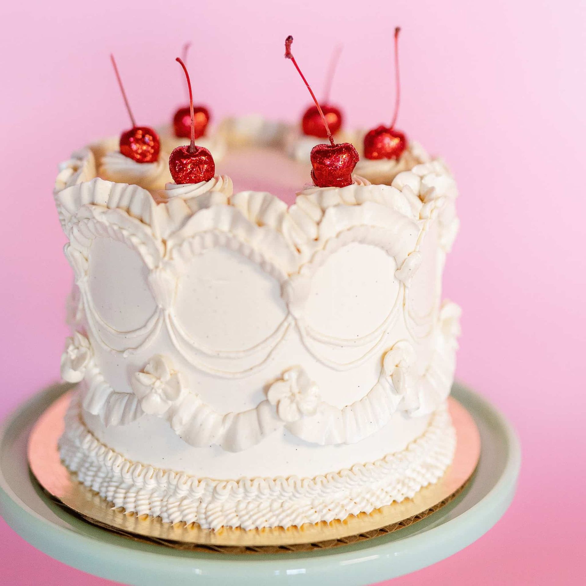 A bouquet of flowers is sitting on a table next to a chandelier.