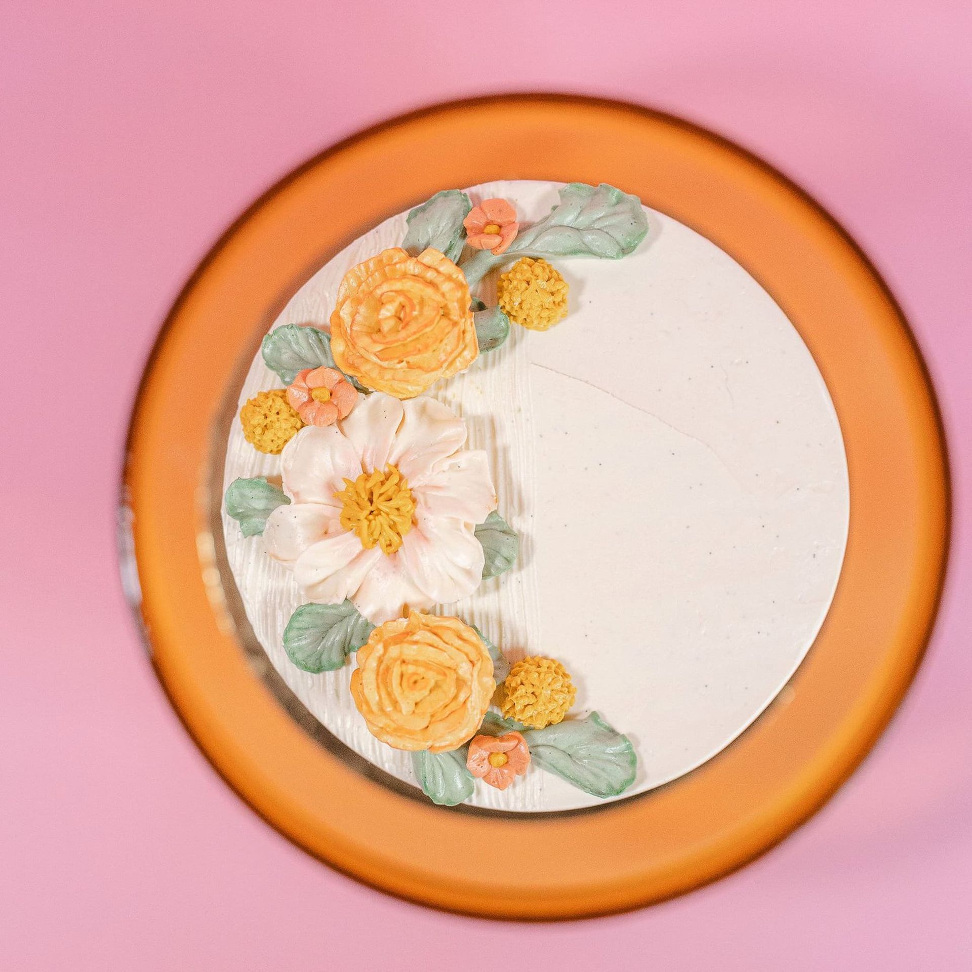 The bride is holding a bouquet of flowers in front of a mirror.