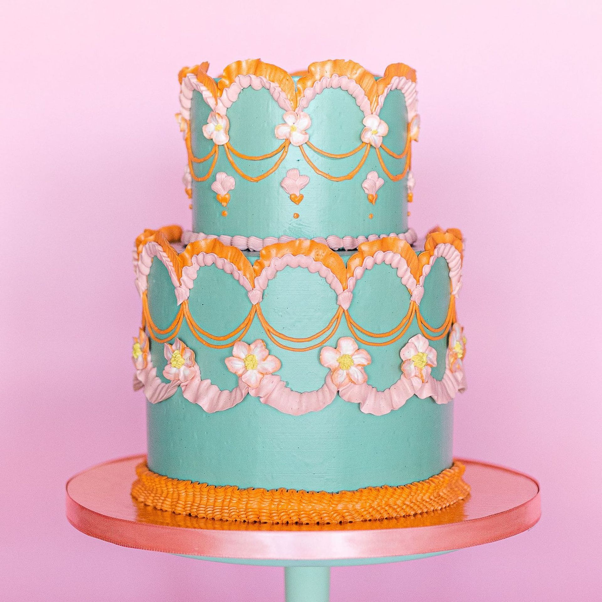 A bride in a white dress is holding a bouquet of white flowers.