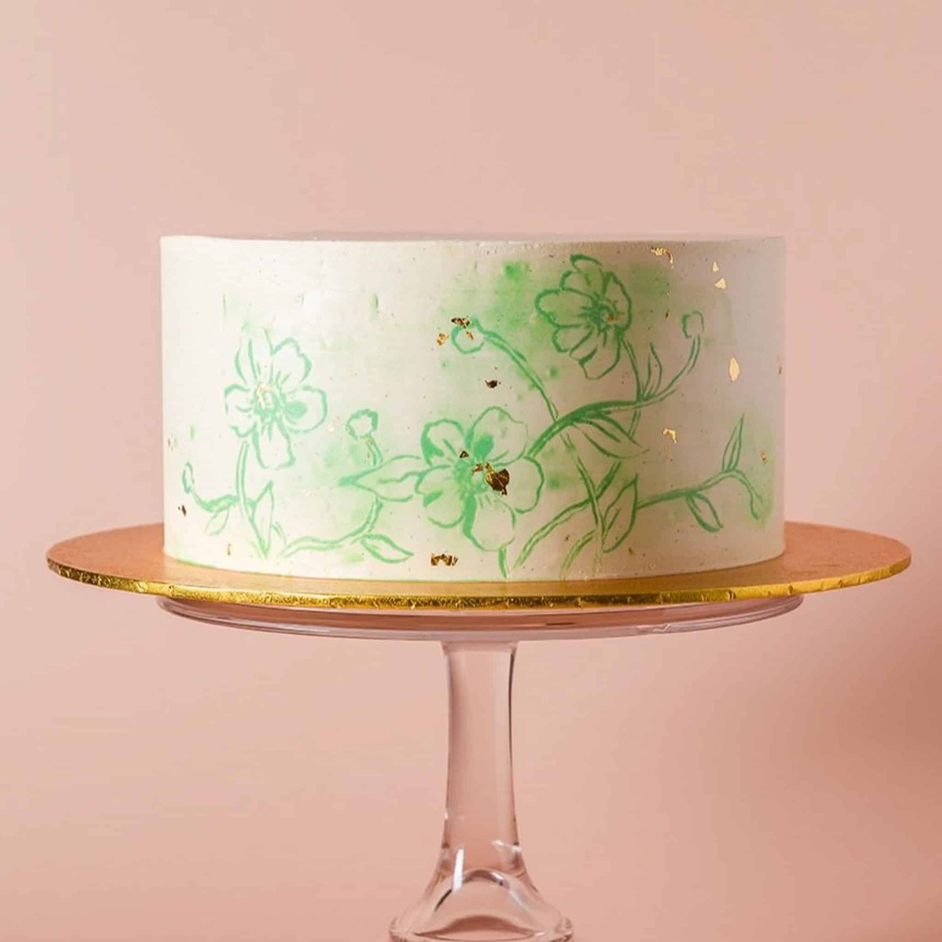 A woman in a white dress is holding a bouquet of flowers.