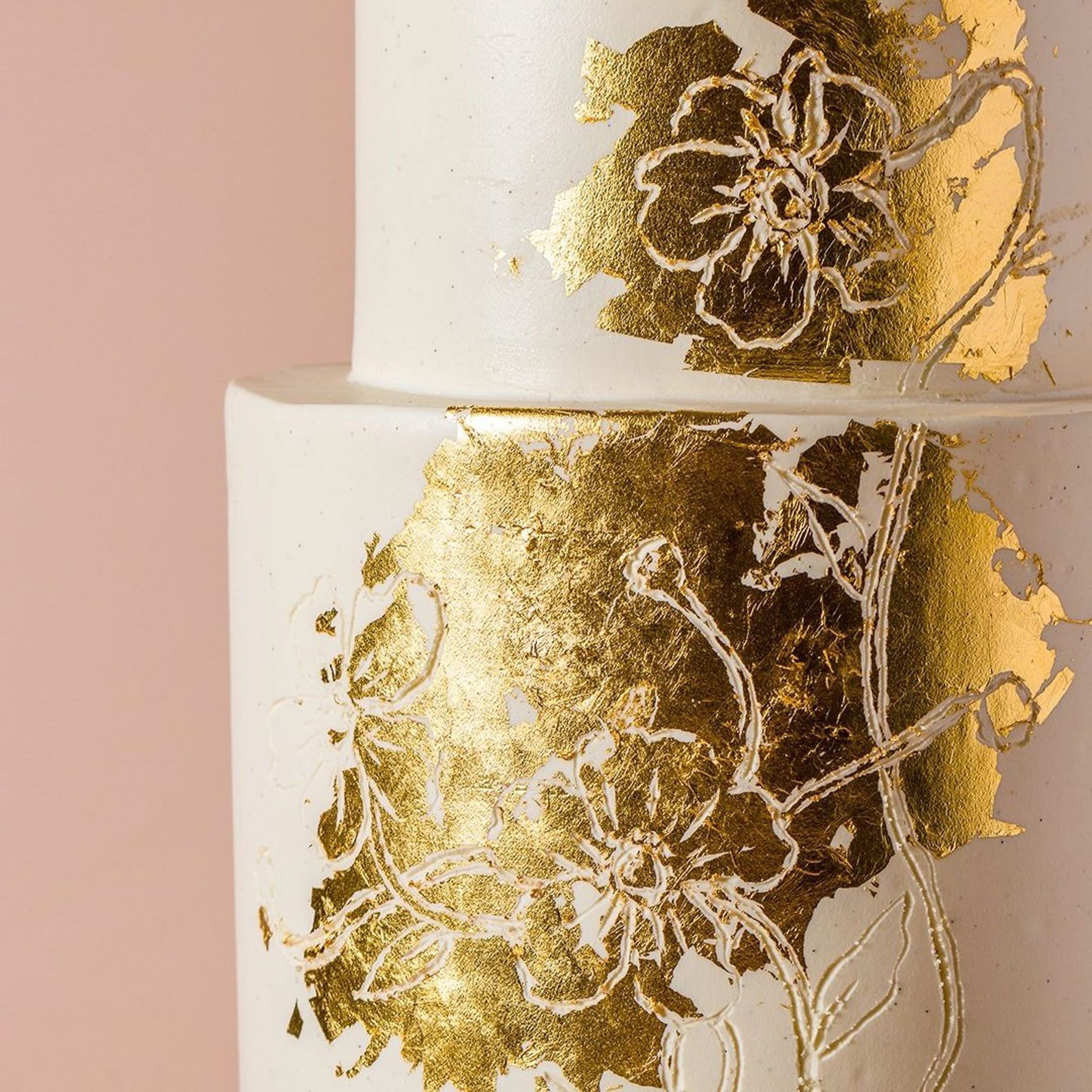 A woman in a white dress is holding a bouquet of flowers.