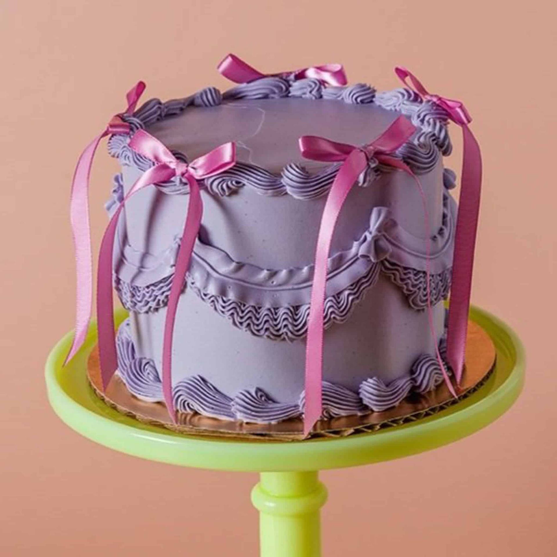 A close up of a bouquet of pink roses with a wedding ring in the middle.